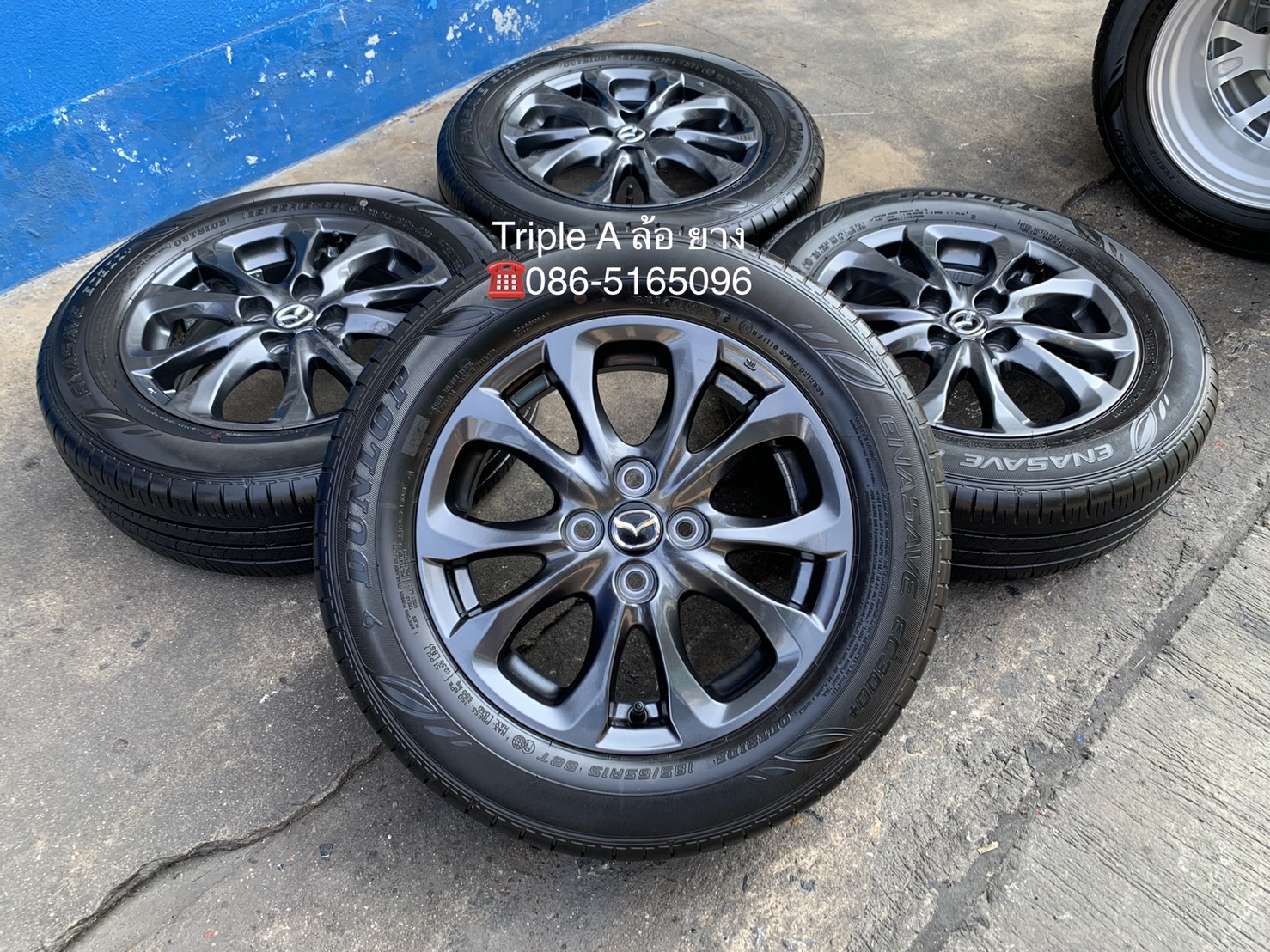 ล้อแม็ก Mazda 2 Skyactiv ขอบ 15 สีดำ มิดไนท์ พร้อมยาง 185-65-15 Dunlop ปลายปี 19 สภาพน้องๆป้ายแดง