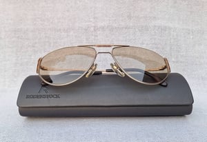 แว่นตาเทพเจ้าของชาวเยอรมัน โรเดนสต็อค–RODENSTOCK รุ่นลักซ์ชัวรีหายาก Lifestyle 7073 สภาพเทพ เก่าเก็บทศวรรษ 1980 โคตรเลนส์กระจกคริสตัล–ออโต้–อิตาเลียน บาร์เบรินี–BARBERINI ที่ได้รับยกย่องว่าเป็น 1 ในเลนส์กระจกแว่นตาที่ดีที่สุดในโลก สีน้ำตาลวอลนัท–สว่าง ปรับความเข้มอัตโนมัติ ขนาดมาตรฐาน–ใหญ่ 142mm