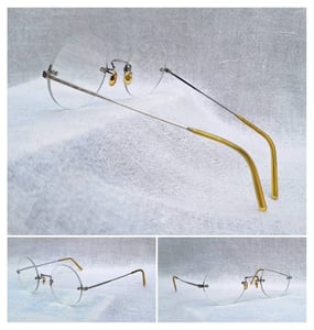 แว่นตาแฮนด์คราฟท์–หยดน้ำกลม–ไร้กรอบยุคโชวะ ราคานักศึกษา ป.โท เจแปนิสริมเลส–JAPANESE RIMLESS GLASSES 1950s เฟรมวัสดุคลาสสิก SPM Sun Platinum Metal–โลหะแพลทินัมแสงตะวัน เลนส์บลูโพรเทค มัลติโค้ท ค่าสายตา +200 ป้องกันแสงสีฟ้าที่อันตรายจากคอมพิวเตอร์ทุกชนิด ขนาดมาตรฐานโมเดลนี้120mm สวมใส่ได้ทุกขนาดใบหน้า