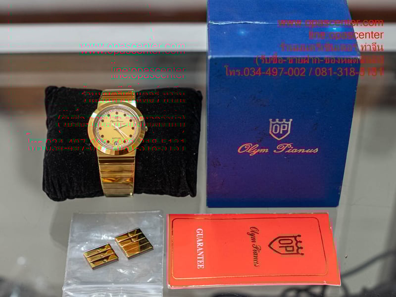 นาฬิกาข้อมือ สายสแตนเลส O.P (Olym Pianus) รุ่น 8242M-405E พลอยแดง 11 กระจก Sapphire Crystal มือสอง สภาพใหม่ มีกล่อง สายต่อ นาฬิกาข้อมือ สายสแตนเลส O.P (Olym Pianus) รุ่น 8242M-405E พลอยแดง 11 กระจก Sapphire Crystal มือสอง สภาพใหม่ มีกล่อง สายต่อ